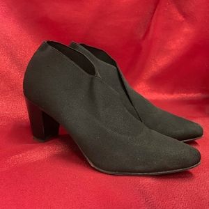 Black Stuart Weitzman ankle boots.